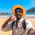 happy-tourist-gesturing-thumbs-up-taking-selfie-on-D4BSAWU